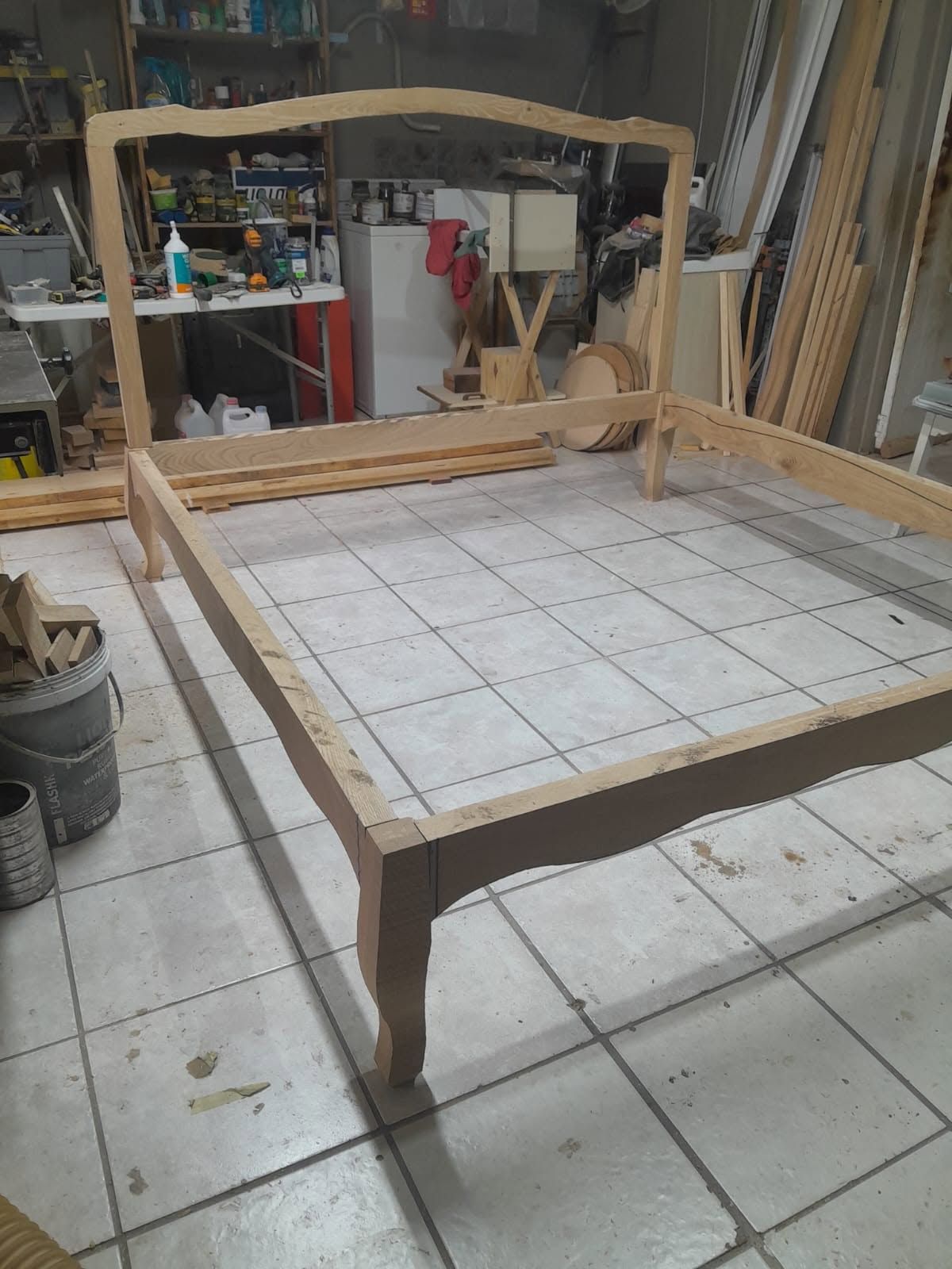 The bed frame standing assembled in the workshop