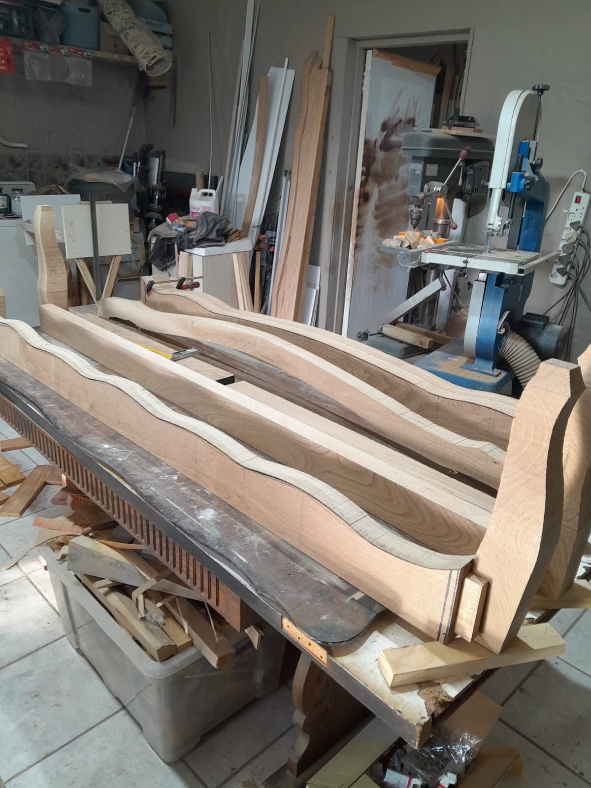 Curved oak headboard pieces in the workshop