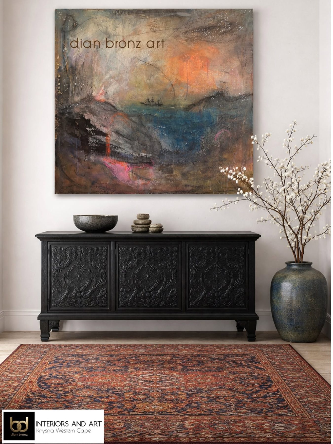 A landscape painting above a carved cabinet